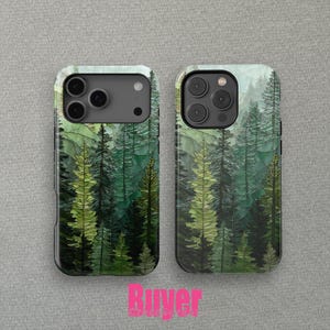 May include: Two phone cases with a forest scene design. The cases feature a green and white watercolor-style illustration of tall evergreen trees. The cases have a black border and are designed to fit a smartphone.