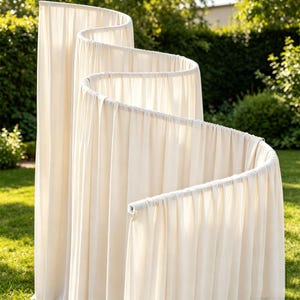 May include: A tall, off-white fabric room divider featuring a serpentine, S-shaped frame. The lightweight, opaque material is draped over a series of connected vertical poles, creating a continuous, flowing wave pattern that stands upright.