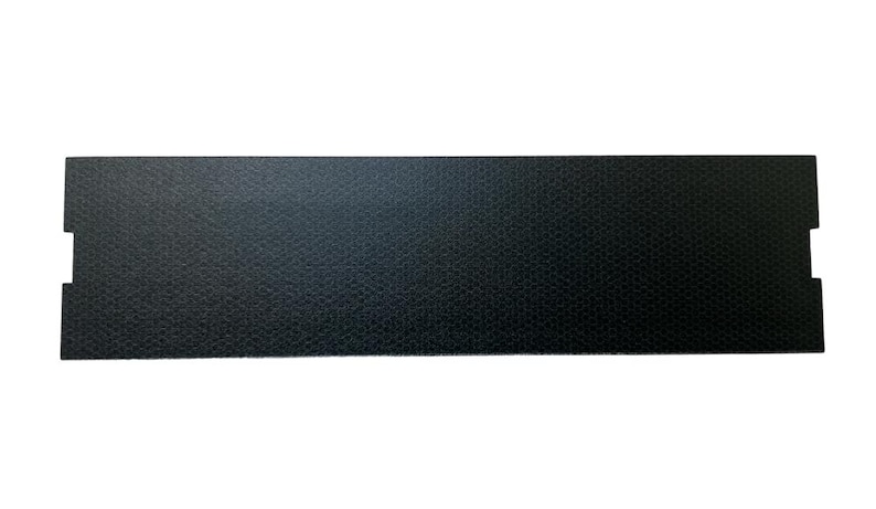 May include: A black rectangular piece of textured material with rounded corners and cutouts on either side.