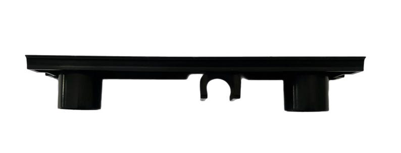 May include: Black plastic drain grate with three vertical pipes and a centre clip. The drain grate is designed for a shower or bathroom.