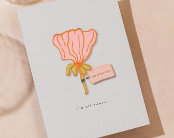 May include: A light gray greeting card featuring a stylized illustration of a pink flower with an orange outline and green stem. A small pink tag attached to the stem with a black clip reads NO REFUNDS. The text i'm all yours. is printed below.
