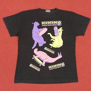 May include: Black t-shirt with a graphic print of three cartoon creatures skateboarding. The creatures are purple, green, and pink. The text "MXMXM RADICAL MUSH MISFITS" is printed on the shirt.