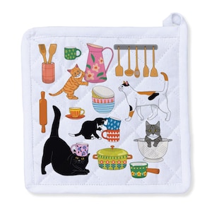 May include: White quilted pot holder with a colorful cat and kitchen utensil design. The design includes various cats, mugs, a rolling pin, a pitcher, and cooking utensils. The pot holder has a white border and a loop for hanging.