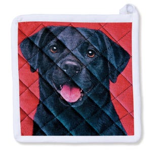 May include: Square pot holder featuring a black Labrador Retriever with brown eyes and a pink tongue, set against a red quilted background. The pot holder has a white border and a loop for hanging.
