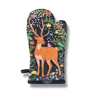 May include: Black oven mitt with a quilted design featuring a deer standing in a colorful floral garden with a small bird perched on its back. The text "NAKED DECOR" is printed on the bottom of the mitt.