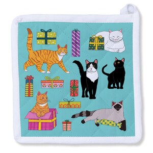 May include: A square, quilted potholder with a teal background featuring various cartoon cats and wrapped gifts. Cats are orange tabby, black, white, and Siamese. Gifts are in various colors with bows. White trim and a hanging loop complete the design.
