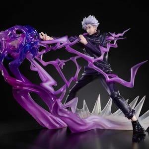 May include: A dynamic figurine of a character with white hair and a dark outfit, posed in action. The figure is surrounded by translucent purple energy effects, with a splash of blue. The base is a stylized white and clear design.
