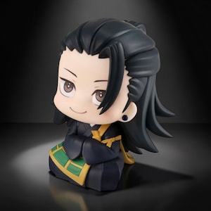 May include: A chibi-style figurine of a character with black hair and a black outfit with gold accents. The figure is kneeling with hands clasped and has a smiling expression. The figure has a green and gold patterned design on the lower part of the outfit.