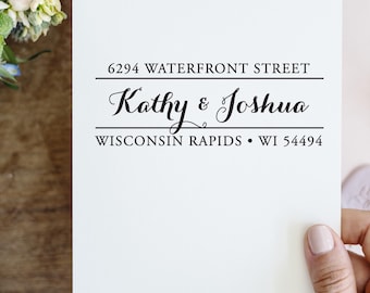 May include: A white card with black text that reads "6294 Waterfront Street, Kathy & Joshua, Wisconsin Rapids, WI 54494".