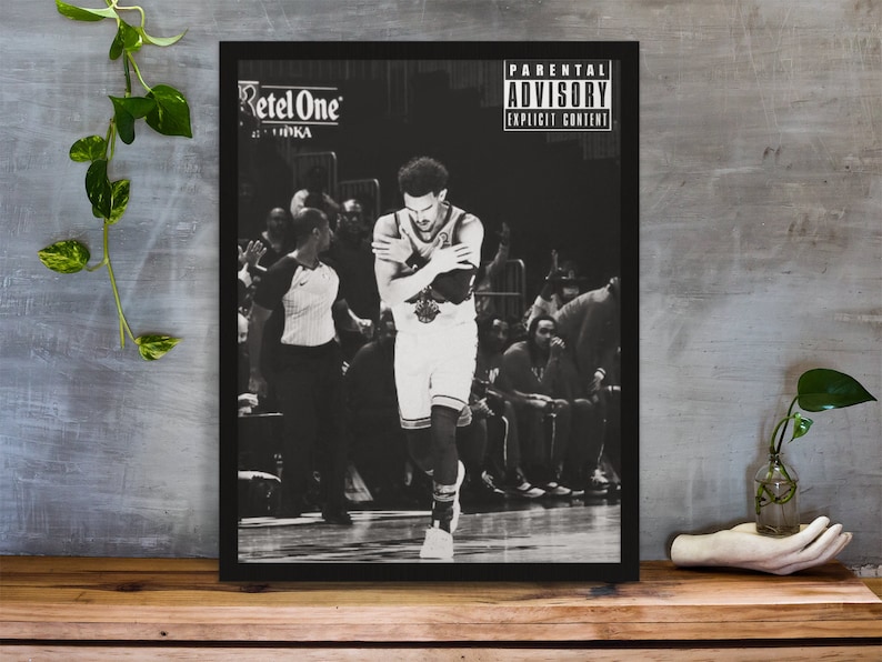 May include: Black and white photograph of a basketball player in a game. The player is wearing a jersey with the number 23 and the text "RetelOne" is visible on the jersey. The photo has a parental advisory label with the text "Parental Advisory Explicit Content".