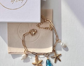 Bracelet à breloques océan plaqué or PVD 18 carats : étoile de mer, perle, coquillage