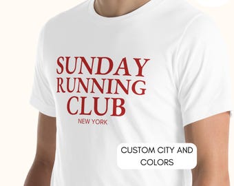 May include: White t-shirt with red text that reads "SUNDAY RUNNING CLUB NEW YORK" and "CUSTOM CITY AND COLORS" in a smaller font.