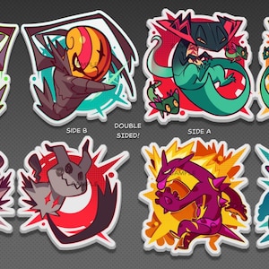 May include: A collection of eight double-sided stickers featuring colorful, stylized illustrations of various creatures. The stickers showcase vibrant colors, including green, red, purple, and yellow, with dynamic poses and designs. The text "SIDE A", "SIDE B", and "DOUBLE SIDED!" is visible.