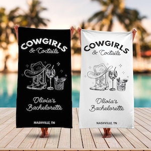 May include: Two black and white beach towels with the text "COWGIRLS & Cocktails" and "Olivia's Bachelorette" with a graphic of a pair of cowboy boots, a hat, and a cocktail glass. The text "NASHVILLE, TN" is at the bottom of each towel.