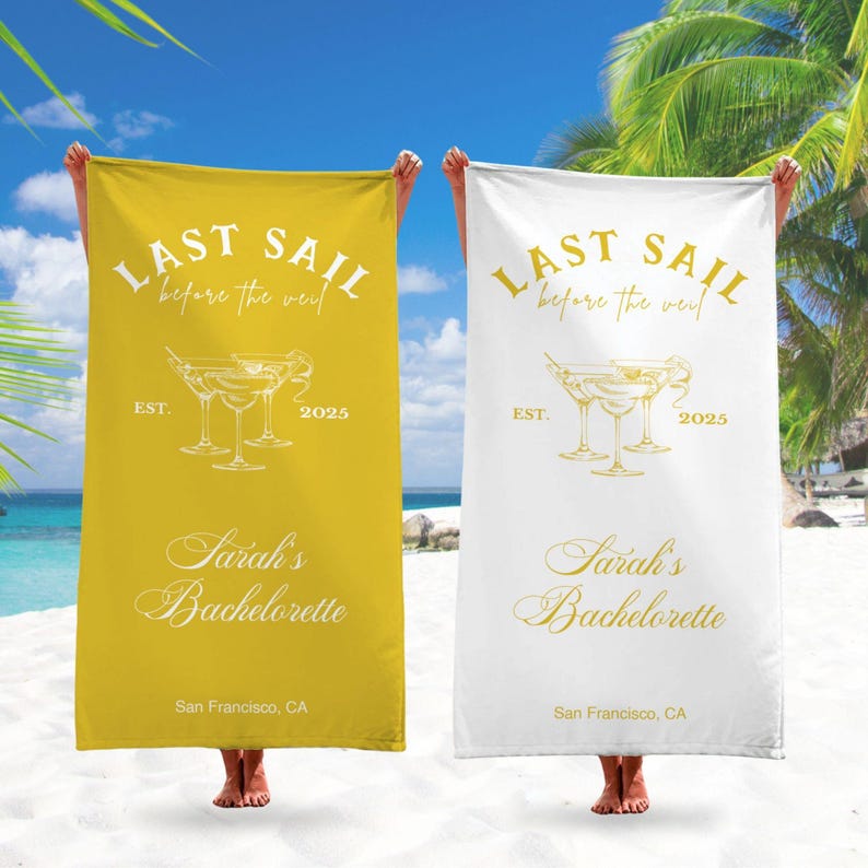 May include: Two yellow and white beach towels with the text "Last Sail Before the Veil" and "Sarah's Bachelorette" in gold lettering. The towels also feature a graphic of three martini glasses and the text "Est. 2025".