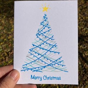 Carte bleue de sapin de Noël