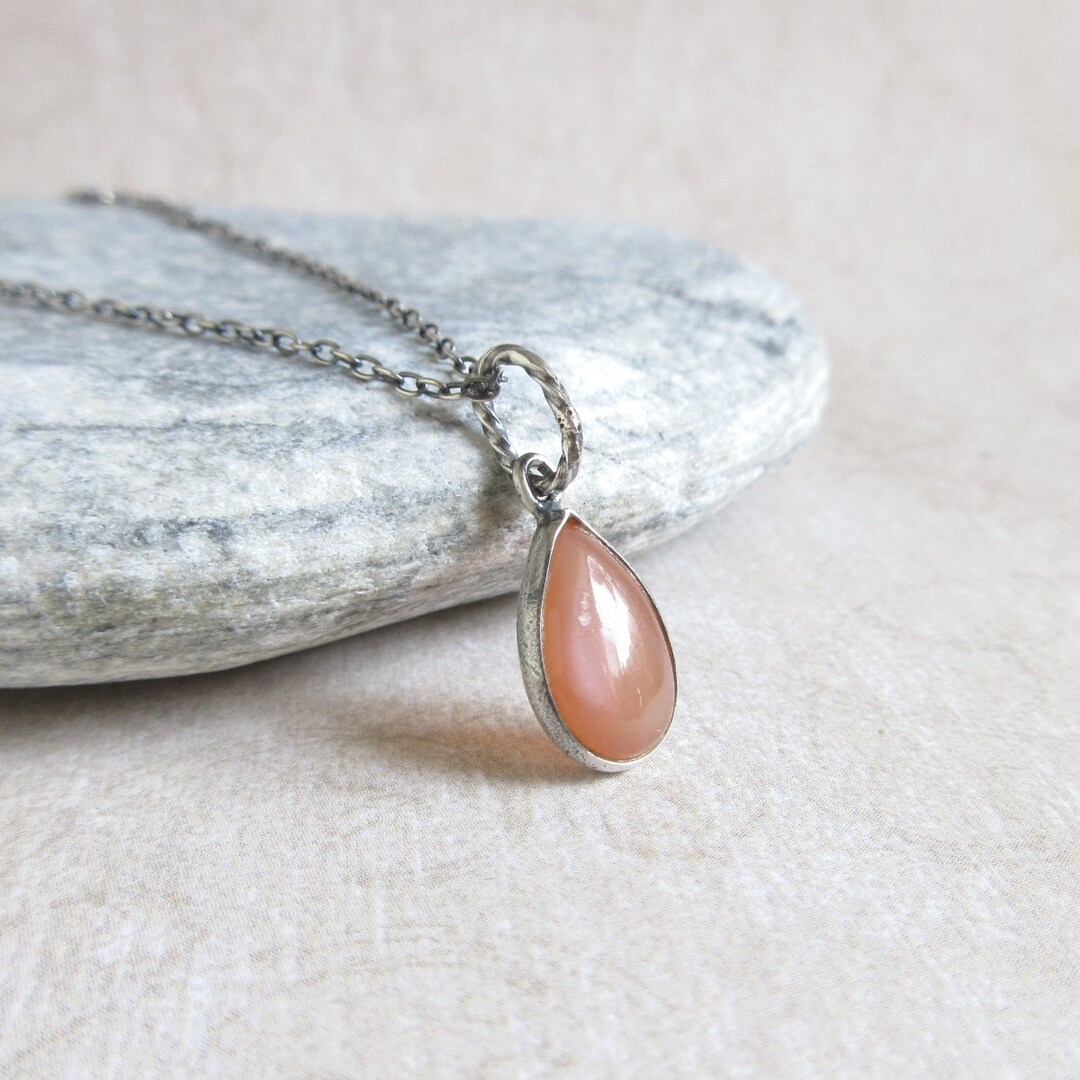 •NYX• peach moonstone + north star + mixed metal necklace (18