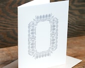 Ornamental O letterpress card