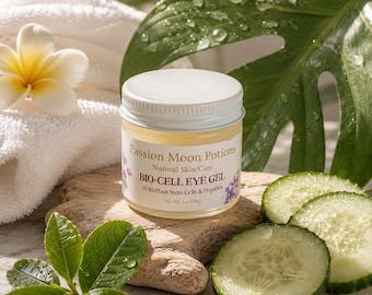 May include: A clear glass jar of Passion Moon Potions Bio-Cell Eye Gel with a white lid. The label reads Natural Skin Care, Bio-Cell Eye Gel, With Plant Stem Cells & Peptides, and Net Wt. 28g.