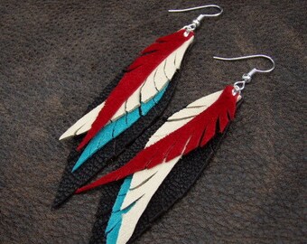 Red, Turquoise and Cream Leather Feather Earrings on Chocolate Brown