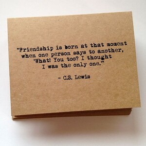 May include: A stack of square, kraft paper cards with a printed quote. The quote, attributed to C.S. Lewis, reads: "Friendship is born at that moment when one person says to another, 'What! You too? I thought I was the only one.'"