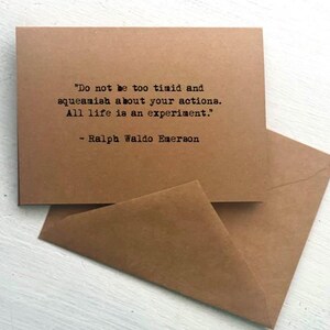 May include: A brown card and envelope set. The card features the quote "Do not be too timid and squeamish about your actions. All life is an experiment." by Ralph Waldo Emerson, printed in black.