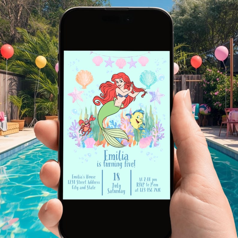May include: A smartphone displays a birthday party invitation featuring a mermaid illustration. The invitation includes the text "Emilia is turning five!" with event details: date, time, and RSVP information. The background is a light blue with sea creatures.
