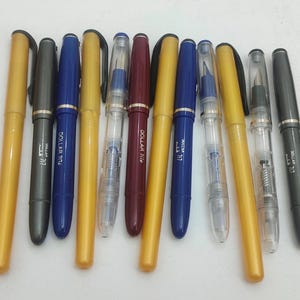 12 stks dollar Kalligrafie piston filler vulpen transparante body Dollar 717 Beginners Vulpen kalligrafie cursief vulpen