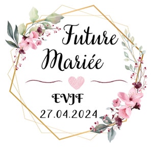 Peut inclure: Un cadre géométrique doré avec des accents floraux roses et verts. Le texte "Future Mariée" est écrit en écriture cursive noire. Le texte "EVJF" et "27.04.2024" sont écrits en noir. Un cœur rose est dessiné au centre du cadre.