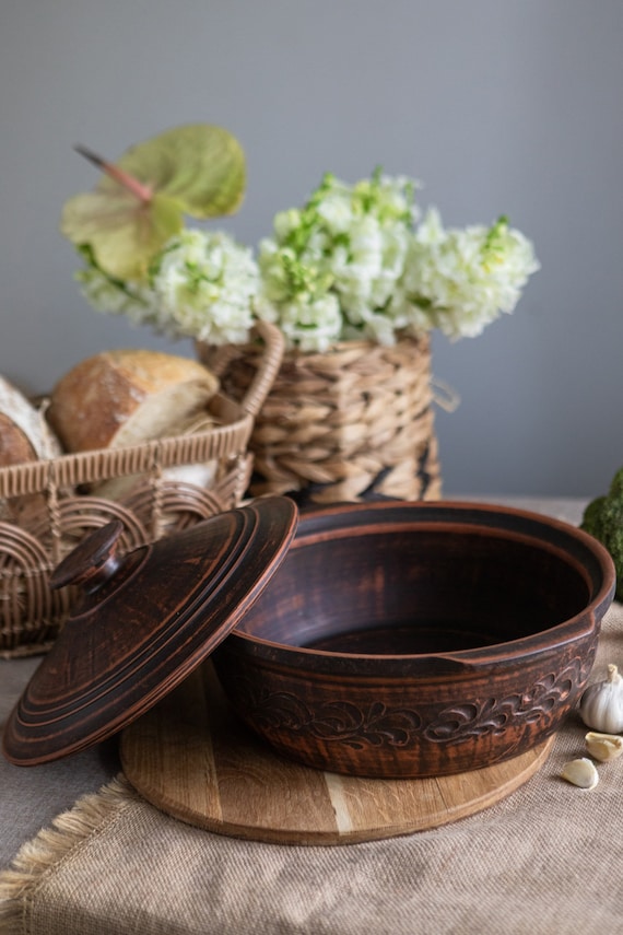 A proper artisan red-clay casserole thrown and fired by hand — rustic, functional, and the kind of statement cookware that sparks a story every time it hits the table.