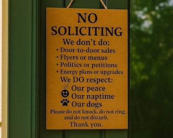 May include: A wooden sign with the words "NO SOLICITING" in black lettering. The sign lists what is not allowed and what is respected, including peace, naptime, and dogs. It hangs on a green door.
