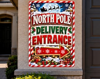 May include: A rectangular metal sign with a red and white candy cane border. The sign features the text NORTH POLE DELIVERY ENTRANCE in red and green lettering, a red arrow pointing right, a silhouette of Santa's sleigh, and wrapped gifts.