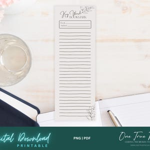 Può includere: Segnalibro stampabile con un design floreale e il testo "Key Word Bookmark". Il segnalibro ha righe per scrivere il titolo del libro e l'autore.