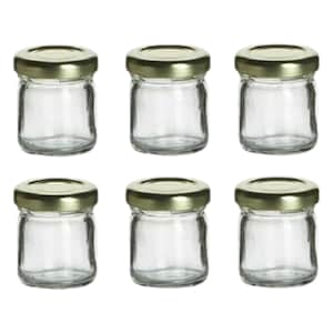 Puede incluir: Seis tarros de vidrio transparentes con tapas doradas. Los tarros son pequeños y perfectos para guardar objetos pequeños como especias, manualidades o joyas.