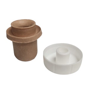 May include: A brown cork bottle stopper with a white plastic top. The stopper has a ring around the top and a textured surface.