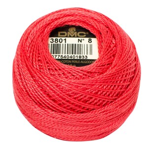 May include: A ball of red DMC embroidery floss with a label that reads "DMC No. 8 3801 077540401833  10g  Coton Perle - Algodon".
