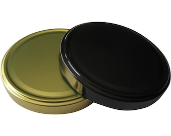 May include: Two round metal jar lids, one gold and one black.