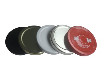 May include: Four round metal jar lids in black, gold, white, and red. The red lid has the text "Safety Button Pops Up When Original Seal Is Broken" printed on it.