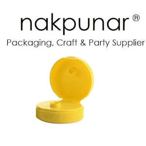 May include: Yellow plastic bottle cap with a flip top. The cap is open and the top is flipped up. The cap is for a bottle of liquid.