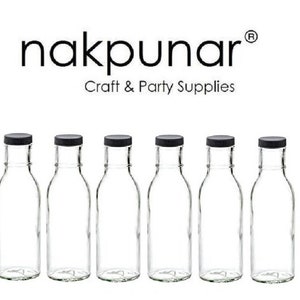 May include: Six clear glass bottles with black lids. The bottles are empty and have a classic shape. The text "nakpunar Craft & Party Supplies" is above the bottles.