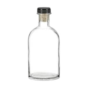 Puede incluir: Una botella de vidrio transparente con una tapa negra y un tapón de corcho. La botella está vacía y tiene una forma redondeada.
