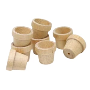 May include: A set of eight small, unfinished wooden flower pots. The pots are all the same size and shape, and they are made of natural wood.