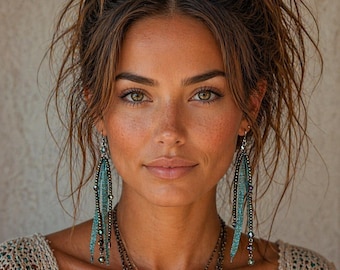 Crystal feather look dangling earrings in blue