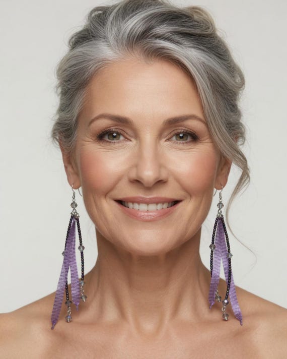 Crystal feather look dangling earrings in lavender