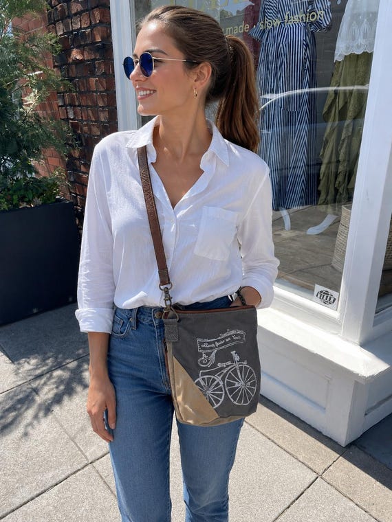 Canvas and leather crossbody handbag with bicycle graphic