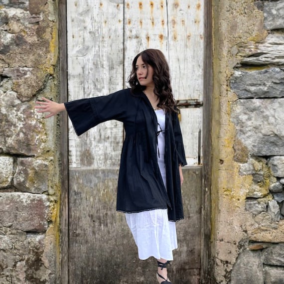 Semi sheer one size cotton voile black tie jacket with loads of details