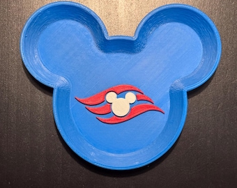 May include: A blue, 3D-printed tray shaped like a mouse head silhouette. The center features a white mouse head icon surrounded by two red, stylized wave-like shapes. The tray has raised edges and a textured surface consistent with 3D printing.