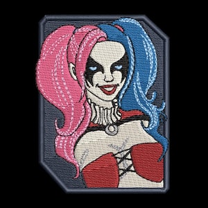 May include: An embroidered patch featuring a character with split-colored pink and blue hair in pigtails, black eye makeup, and a red corset top with black lace-up detailing. The design is set against a dark gray background with a geometric border.