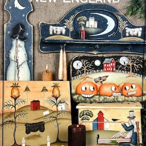May include: A collection of painted wooden folk art pieces featuring the text THE BACK ROADS OF NEW ENGLAND and BY JOHN SLINEY OF A BRUSH WITH THE PAST. The items include a snowman, a shelf with sheep, pumpkins, and a box with a musician.