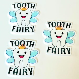 May include: Three white tooth fairy stickers with blue wings and a gold crown. Each sticker says "Tooth Fairy" in black text.